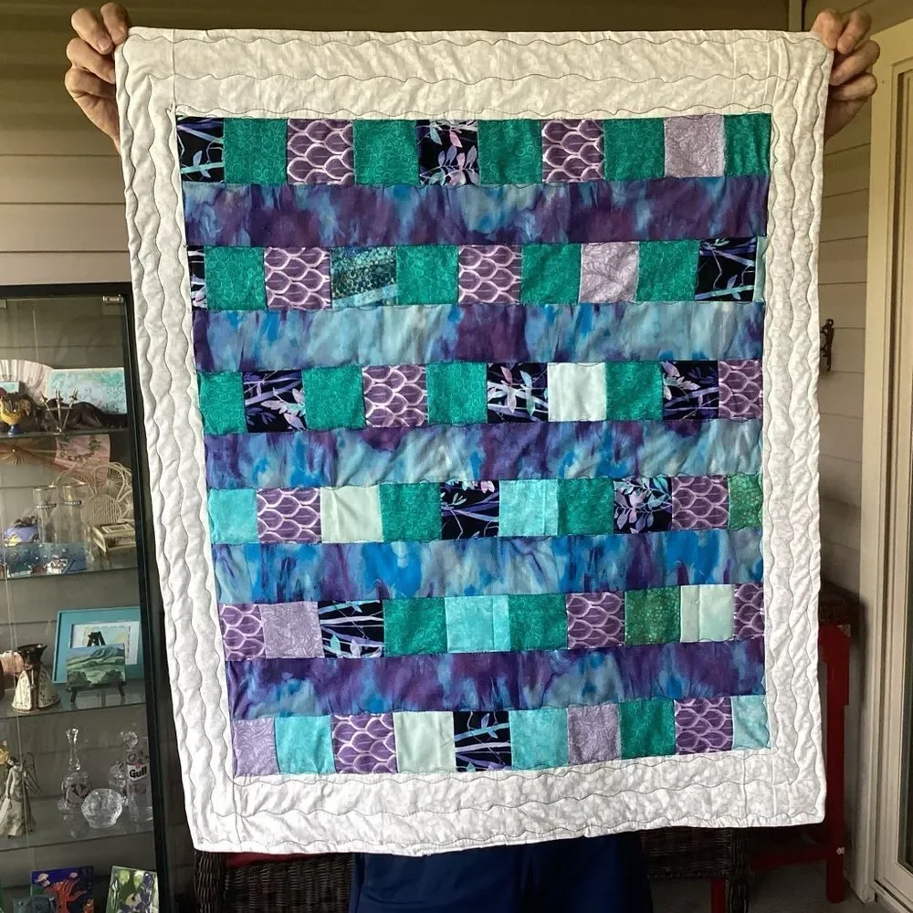 NWT. Hand Crafted Patchwork Quilt with Blues, Purples and Teals Accents